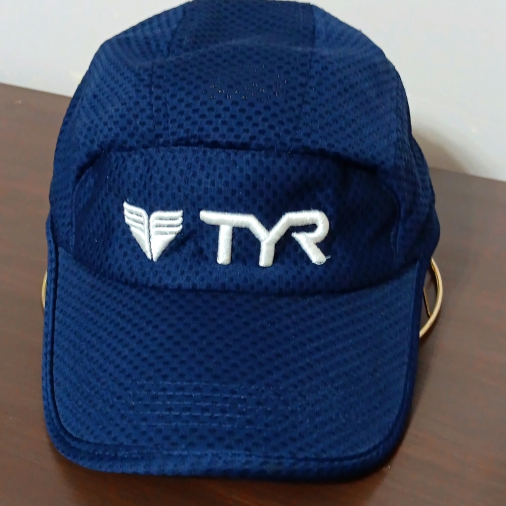 TYR 100% poly, adult size velcro adjustable strap. Blue mesh panels for cooling.